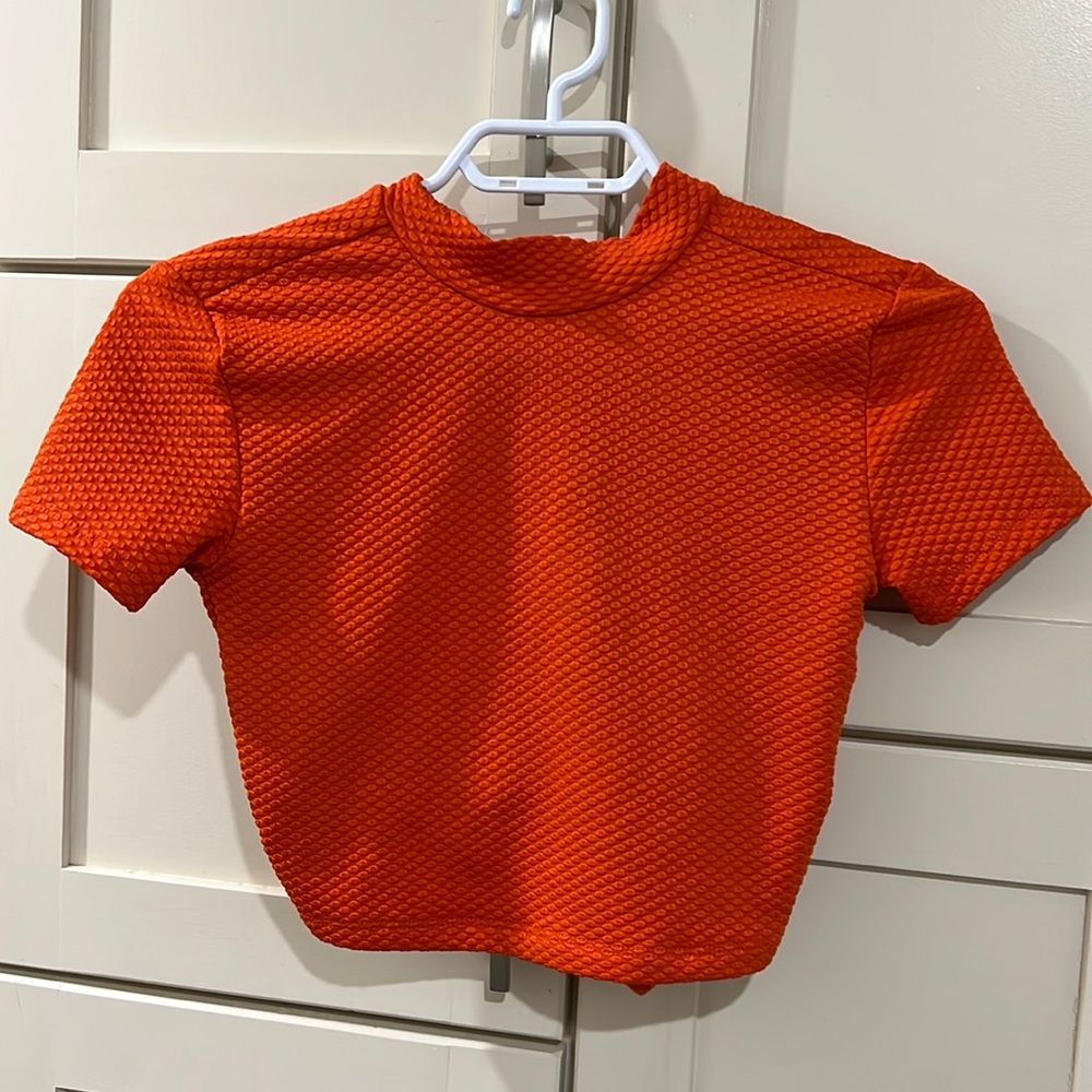 UO orange crop top open back with bowes